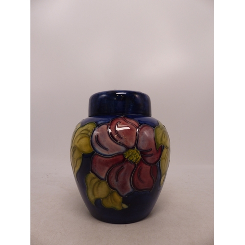 423 - Moorcroft Anemone on Blue Ground Ginger Jar. Paper label to base. Height: 15cm