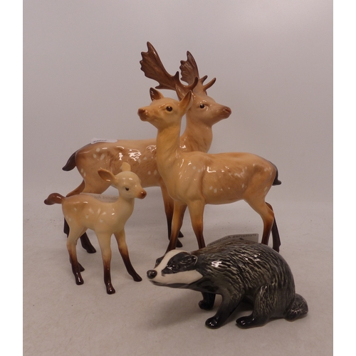 498 - Beswick Stag Family including Stag, Deer and Fawn together with a Beswick Badger (4)