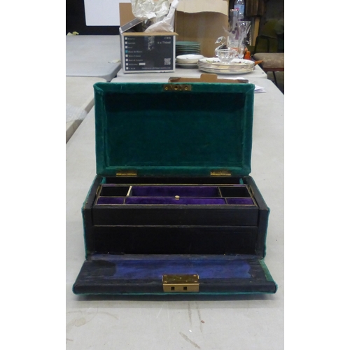 287 - A Velvet and Gilt Jewellery Box with Black Leather and Purple Velvet Interior. Length: 29cm