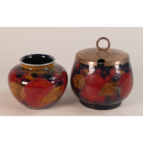 124 - William Moorcroft, Small Pomegranate Pattern Vase and Lidded Preserve Pot. Height of tallest: 7cm (2... 