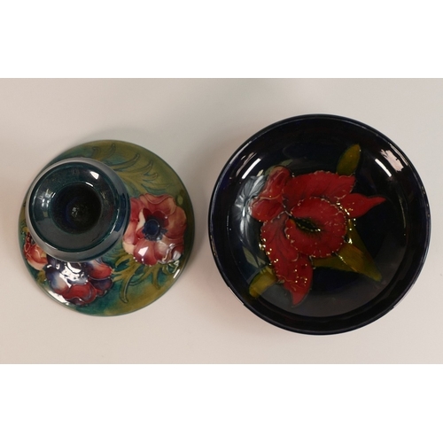 130 - Moorcroft, Footed Dish in the Orchid Design and Anemone Pattern small Candlestick. (2)