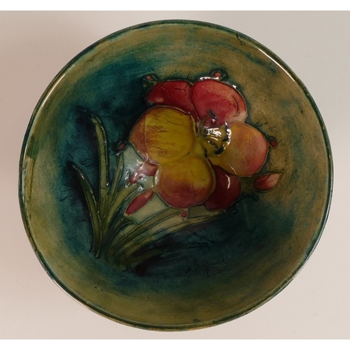 131 - Moorcroft, Small Footed Bowl in the Fresia design on Green Ground. Diameter: 10.5cm