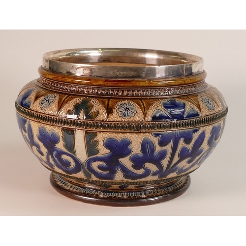 145 - Doulton Lambeth, Stoneware Bowl with Hallmarked silver rim. Decorated with scrolling foliage. Impres... 