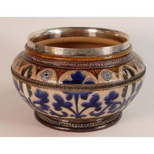 145 - Doulton Lambeth, Stoneware Bowl with Hallmarked silver rim. Decorated with scrolling foliage. Impres... 