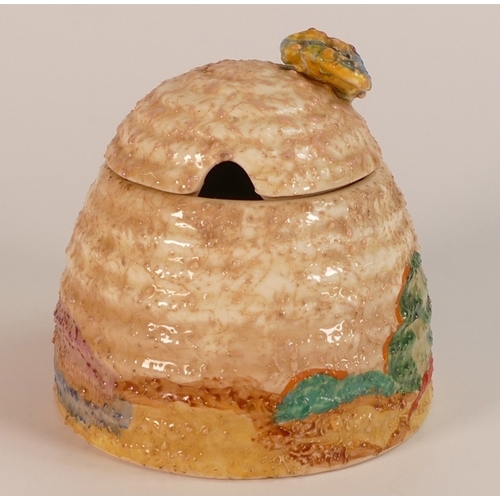 155 - Clarice Cliff for Newport Pottery, Beehive Honeypot and Cover in the Patina Design. Height: 9.25cm