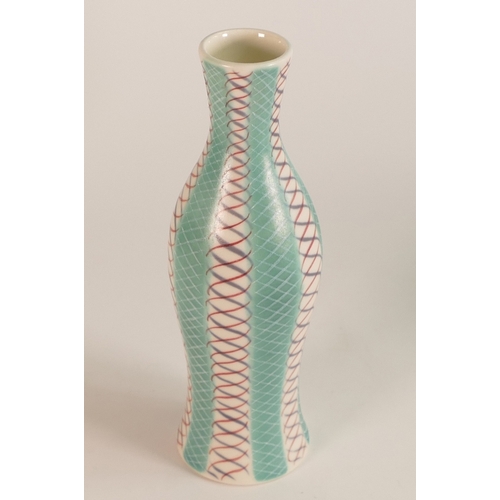 240 - Poole Pottery Geometric Spiral Bottle Vase. Decorated in pastel teal, red and blue. Height: 19cm