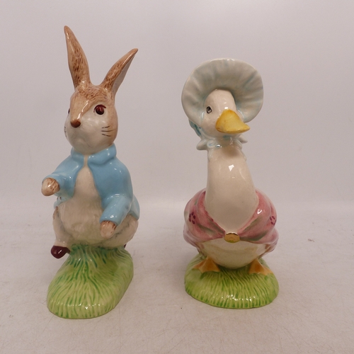 167 - Two Beswick Beatrix Potter Figures to include Peter Rabbit and Jemima Puddleduck both with Gold Back... 