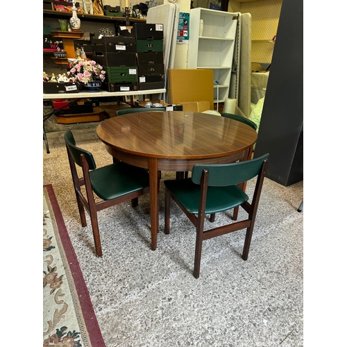 678 - Mid Century Modern Round Extending Formica Top Dining Table with 4 Matching Green Vinyl Upholstered ... 