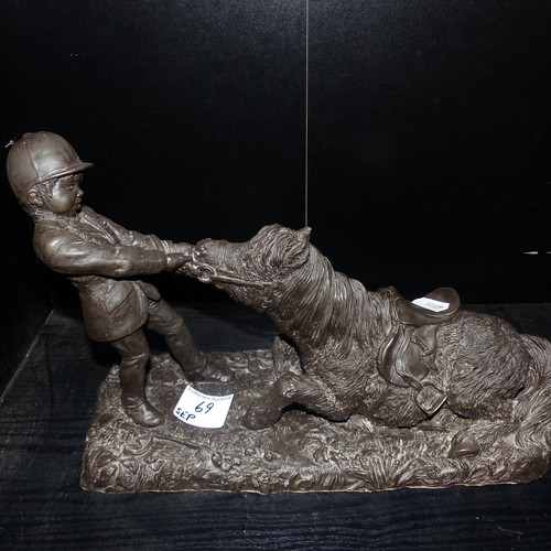 69 - Heredities bronzed resin figure depicting a boy and pony. Length: 33cm