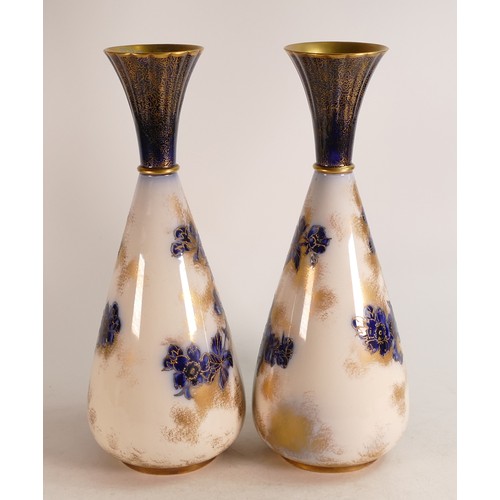 54 - A pair of Carlton Blush ware large footed vases with blue & white Florida floral decoration, by Wilt... 