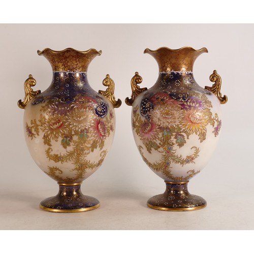 69 - Two Carlton Blush ware twin handled vases with floral Chrysanthemum decoration in slightly different... 