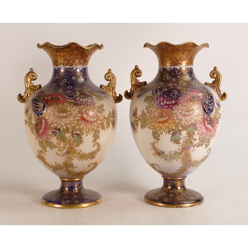 69 - Two Carlton Blush ware twin handled vases with floral Chrysanthemum decoration in slightly different... 