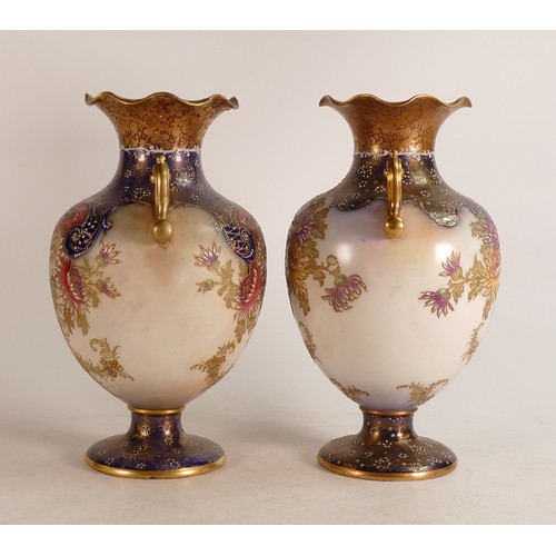 69 - Two Carlton Blush ware twin handled vases with floral Chrysanthemum decoration in slightly different... 