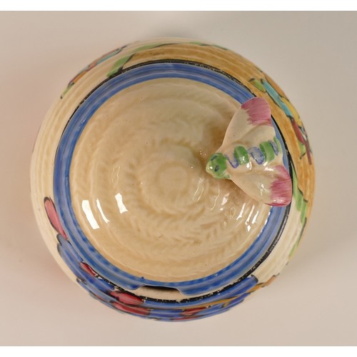 84 - Clarice Cliff for Newport Pottery, Beehive honey pot and cover in a blossoming tree Design. Height: ... 