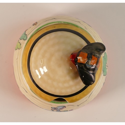 87 - Clarice Cliff for Newport Pottery, small Beehive honey pot and cover decorated with a lone female fi... 