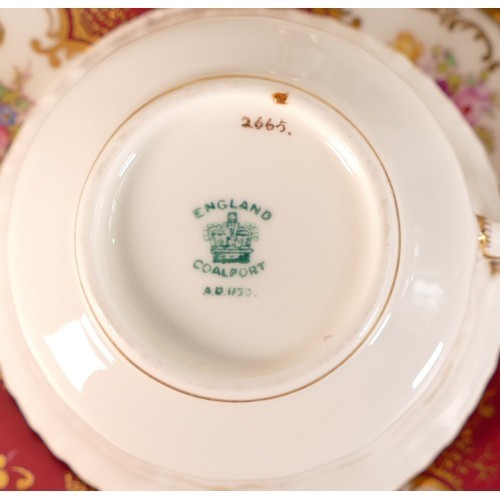 96 - 19th century Coalport gilded tea set, decorated with panels of flowers on red & white ground. (21)