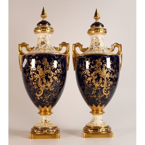 97 - 19th century Coalport pair of two handled vase & covers, gilded all over & decorated with panels of ... 