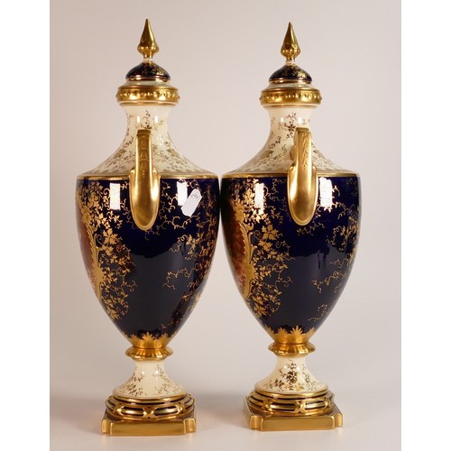 97 - 19th century Coalport pair of two handled vase & covers, gilded all over & decorated with panels of ... 