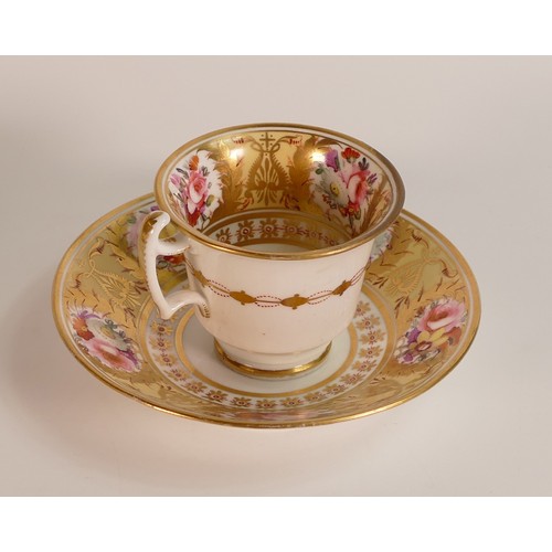 119 - Coalport, c.1820 Etruscan pattern 824 coffee cup and saucer. Hand painted floral reserves within gil... 