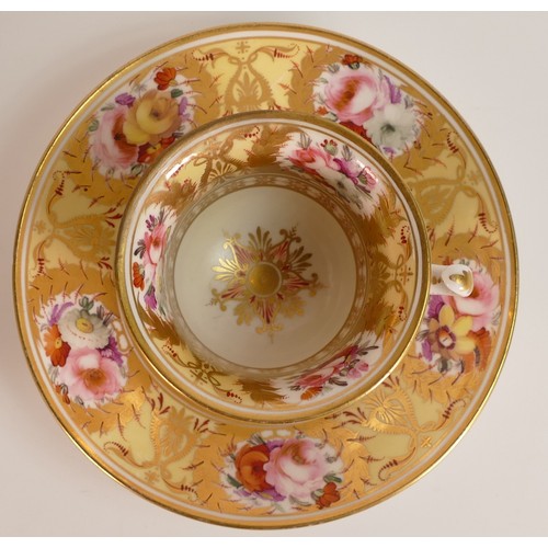 119 - Coalport, c.1820 Etruscan pattern 824 coffee cup and saucer. Hand painted floral reserves within gil... 