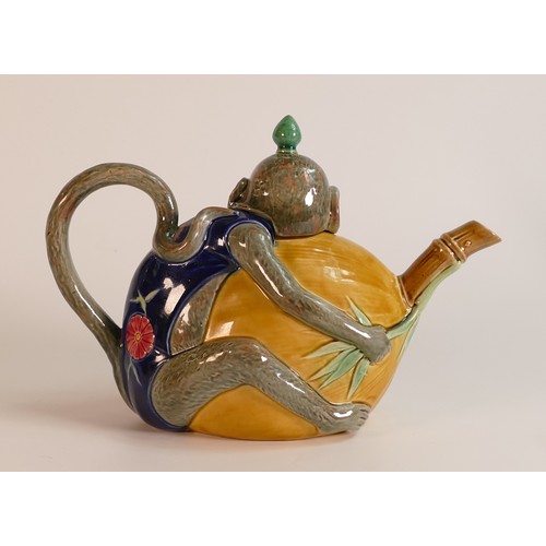 164 - Minton Majolica tea pot, modelled as a monkey wearing a blue oriental costume and holding a coconut,... 