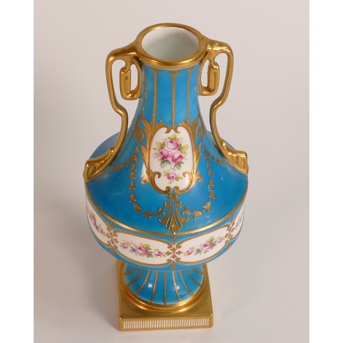 182 - Mintons two handled gilded vase, decorated with hand painted panels of roses, on light blue ground, ... 