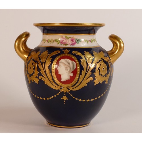 186 - Minton gilded two handled vase, decorated with portrait panels on royal blue ground, h.11.5cm.