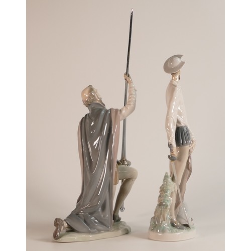 203 - Two Lladro Porcelain figures of Don Quixote. One knelt with lance in hand, the other in fighting sta... 