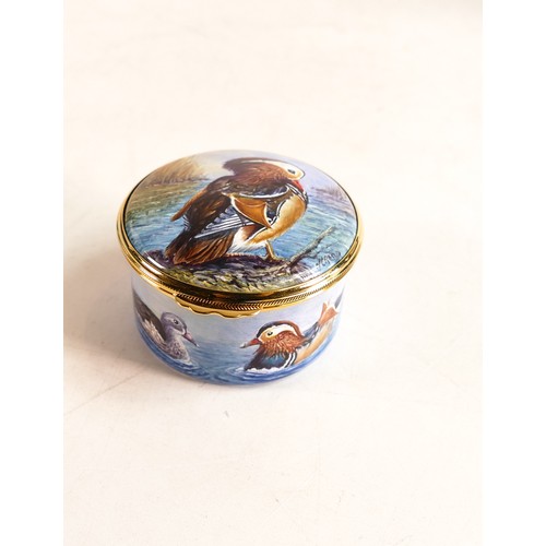 217 - Moorcroft enamel Mandarin duck lidded box by Nigel Creed. Limited edition 1/3. Boxed, diameter 5.5cm