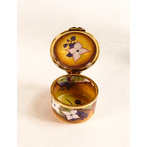 254 - Moorcroft enamel Dogwood round lidded box by Anji Davenport. Limited edition 70/100. Boxed, diameter... 