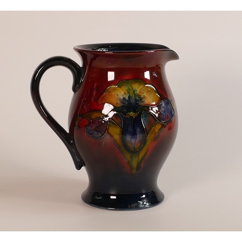 269 - William Moorcroft, Flambe Orchid jug, late Queen sticker to base. Height 15cm.