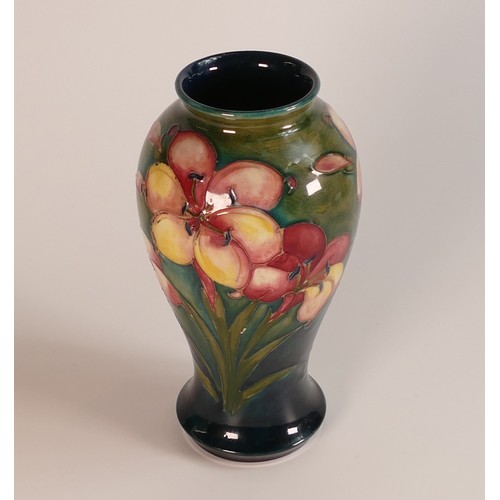 273 - Moorcroft Spring Flowers vase on green background. Height 18cm