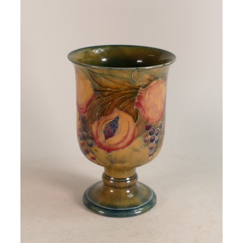 339 - William Moorcroft chalice, c1911, decorated in the Pomegranate design on Ochre ground. h.20.5cm, a/f... 