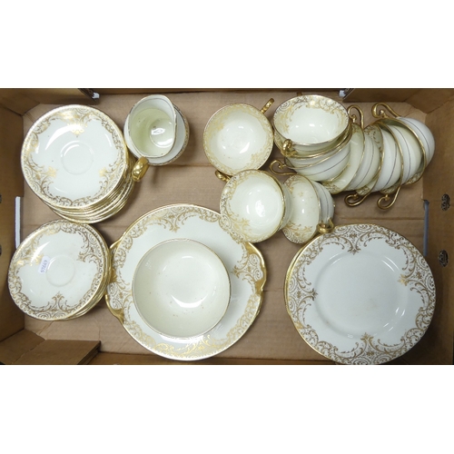 307 - Royal Doulton Cream And Gilt China Tea Set To Include Tea Cups, Saucers, Large Sugar Bowl, Milk jug ... 