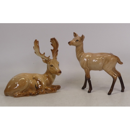 339 - Two Beswick Deer Stag lying down (Antler has been re-attached) and Deer Doe (2)