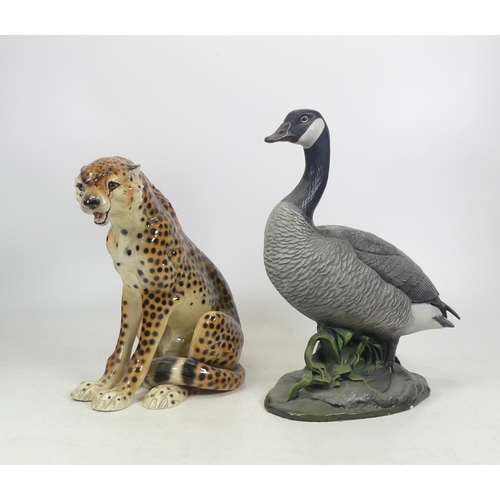 592 - Two Large Ceramic Animals to include a Seated Cheetah and a Goose on naturalistic base Height of tal... 