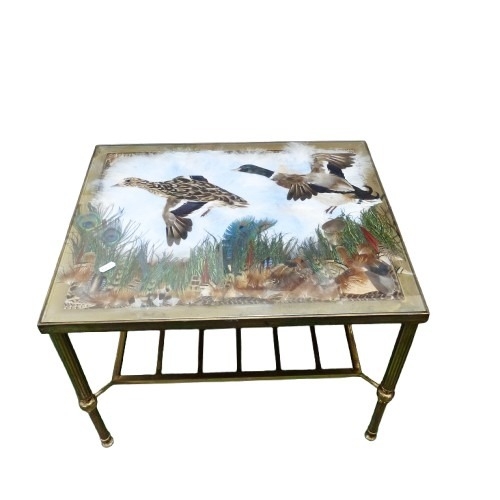 666 - Brass and Glass topped coffee table (Height - 41cm) with flying duck design made of various feathers... 