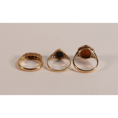 707 - Three 9ct gold dress rings, each stone set with, cameo, Onyx and red stones, sizes J-K, 7.1g. (3)