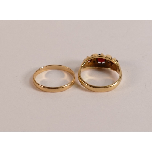 723 - 18ct gold ring set with rubies/garnet stones, size O, 5.2g and 18ct gold wedding ring, 1.9g. (2)