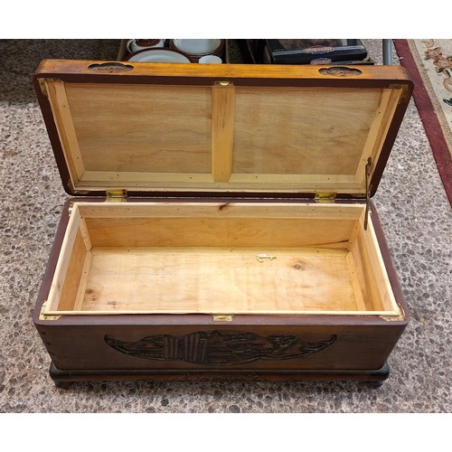 616 - A Small Chinese Camphor Wood Chest with Heavily Carved Oriental Scenes. Height: 32cm Length: 67cm De... 