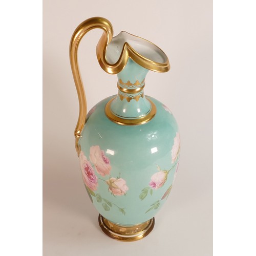 31 - Possibly Derby, a hand painted turquoise ground porcelain ewer. Decorated with fruit still life cont... 