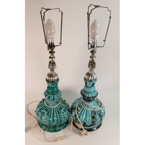 34 - A pair of mid-century Italian Majolica lamps. Turquoise body with white metal fittings. Height to fi... 