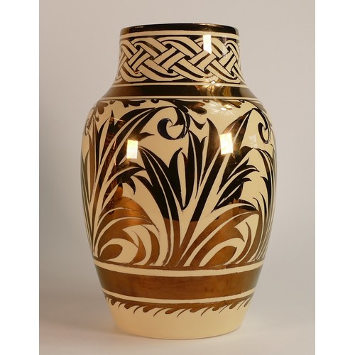 37 - Gordon M. Forsyth, silver Lustre Baluster vase. Decorated with characteristic medieval type knot and... 