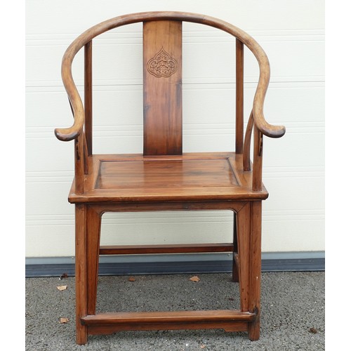 632 - Chinese Horseshoe chair with decorative carved splat. Height: 100cm