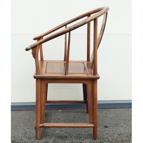 632 - Chinese Horseshoe chair with decorative carved splat. Height: 100cm