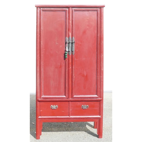 634 - Chinese Wardrobe painted in red. Two lower drawers with two interior drawers and three shelves. Heig... 