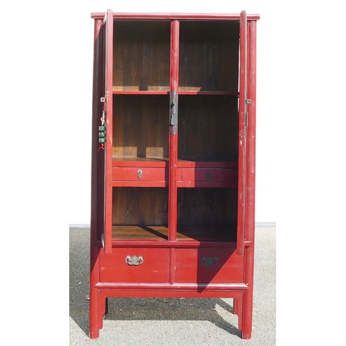 634 - Chinese Wardrobe painted in red. Two lower drawers with two interior drawers and three shelves. Heig... 