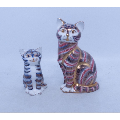 517 - Royal Crown Derby, Two Seated Cat Paperweights (larger has silver stopper, smaller with gold) (2)