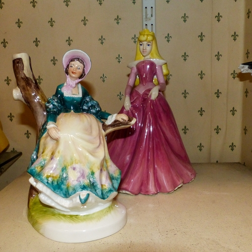 411 - Two China Lady figurines To Include Sleeping Beauty Money Box  Unmarked also Howard J. Wedgwood Emil... 