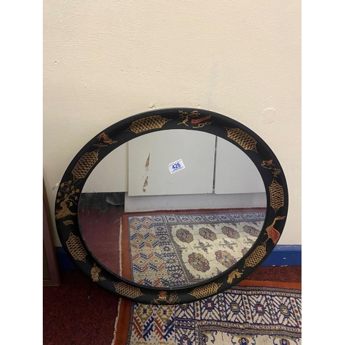 426 - A Japanese Lacquer Effect Painted Mirror. Diameter: 59.5cm